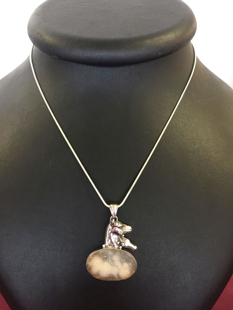 A 925 silver pendant with horse design set with druzy stone, on a rope chain.