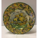A Josep Jordi Guardiola (Barcelona 1869-1950) charger depicting a Galleon and encircling fish. Dated