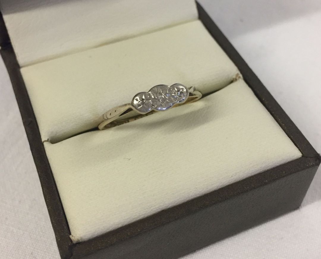 A 9ct yellow gold and platinum trilogy ring set with 3 small diamonds. Size P1/2, weight approx 1.