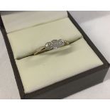 A 9ct yellow gold and platinum trilogy ring set with 3 small diamonds. Size P1/2, weight approx 1.