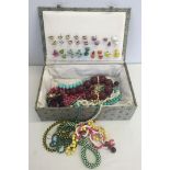A quantity of costume jewellery (earrings & necklaces) in an oriental box.