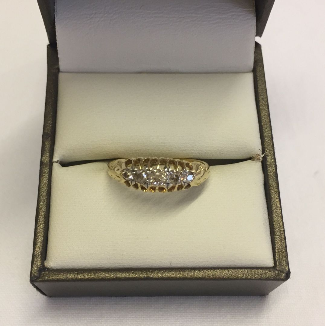 A Victorian 18ct gold ring set with 5 diamonds in an antique setting. Size N, total weight approx