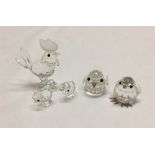 A Swarovski crystal cockerel & 2 chicks together with 2 other crystal birds.