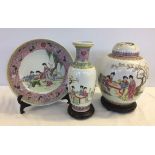 3 large ceramic items depicting scenes of oriental ladies: a plate and stand (33cm diameter), a vase