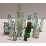 A small collection of vintage glass bottles to include "Oxo" advertising.