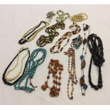 A quantity of vintage bead necklaces to include wooden, glass and faux pearl beads.