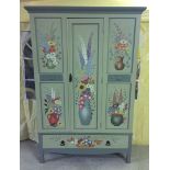 A vintage oak wardrobe with drawer below with handpainted flower decoration and carved 'Art Nouveau'