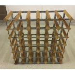 A 36 bottle wood and metal wine rack