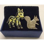2 silver brooches. A squirrel and an enamelled donkey marked 925 Mexico.