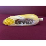 Meiji period Japanese ivory cob of corn with carved figural group to inside. 11cm long.