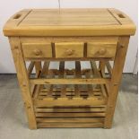 A Spanish cherry wood kitchen block. Removable block, 3 drawers and wine bottle shelf.