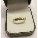 A 9ct gold wave shaped band ring, size Q. 2g total weight.