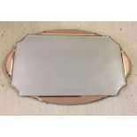 A 1950s 2 tone glass wall hanging mirror.