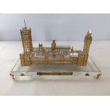 A boxed crystal and gold leaf model of the Houses of Parliament.