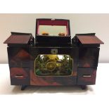 1960s musical jewellery box from Singapore. Lacquered finish in an oriental design with glass