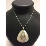 A shell pendant with a 925 bale and mouse motif, on a rope chain.