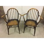 2 Ercol stick back carver chairs.