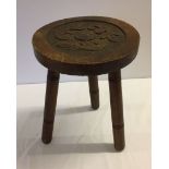 Vintage 3 legged milking stool with carved detail to the seat.