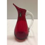 Cranberry coloured Whitefriars glass jug approx 18cm high.