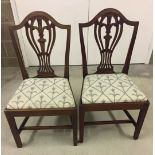 2 vintage mahogany dining chairs with crewel work upholstery seats.