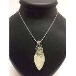 A mother of pearl shell pendant with a 925 silver bale and butterfly motif, on a rope chain.