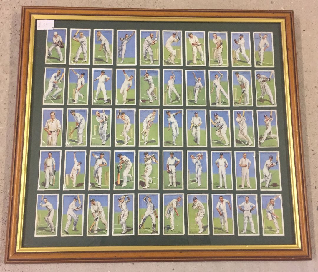 A framed and glazed set of 50 John Players cigarette cards depicting 1930's cricketers.