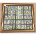A framed and glazed set of 50 John Players cigarette cards depicting 1930's cricketers.