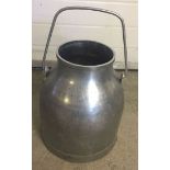 A large stainless steel milk churn. Approx 37cm high.
