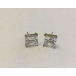 A pair of 9ct gold stud earrings set with large square cut CZ stones.