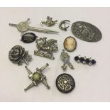 A small collection of brooches to include Miracle Rose brooch and silver cameo.