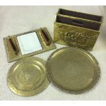 A small quantity of brass items comprising 2 trays, a magazine rack and a hall mirror with brushes.