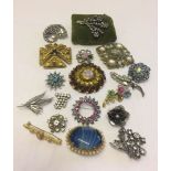 A collection of decorative vintage brooches to include natural stones and rhinestone.