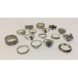 A collection of 16 silver rings, some set with stones.