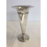 A Birmingham 1911 silver fluted vase, 20cm tall. Some dents to body.