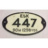 A reproduction Railway sign marked 'Esk, 447, 90m 1298yds".