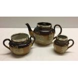 A Royal Doulton stoneware 3 piece teaset comprising: teapot, milk jug, and sugar basin with