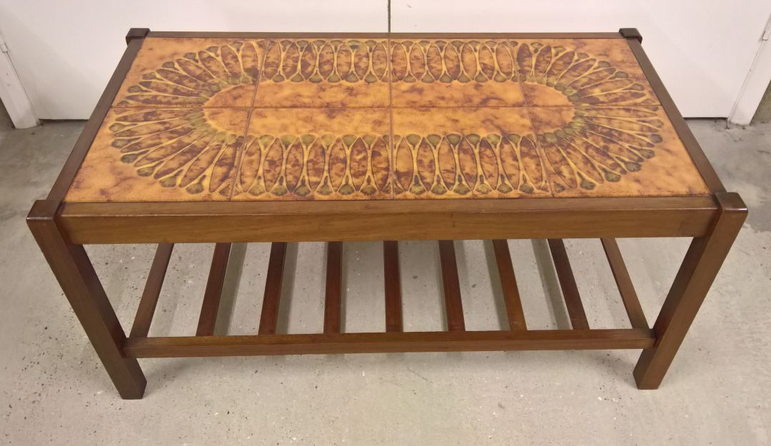 A c1970s brown tile topped coffee table. 87 x 47cm.