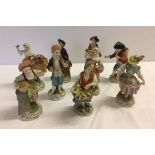 A collection of 9 Dresden market seller figurines (one missing hand, 4 with minor chips).