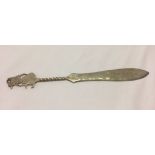 An Asian silver letter opener with engraved surfaces. Marked .800 on blade. Weight approx 32.6g.