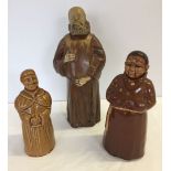 3 ceramic monk shaped decanters (one full).