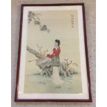 A Chinese print on silk of a girl. Framed & glazed 53 x 33cm.