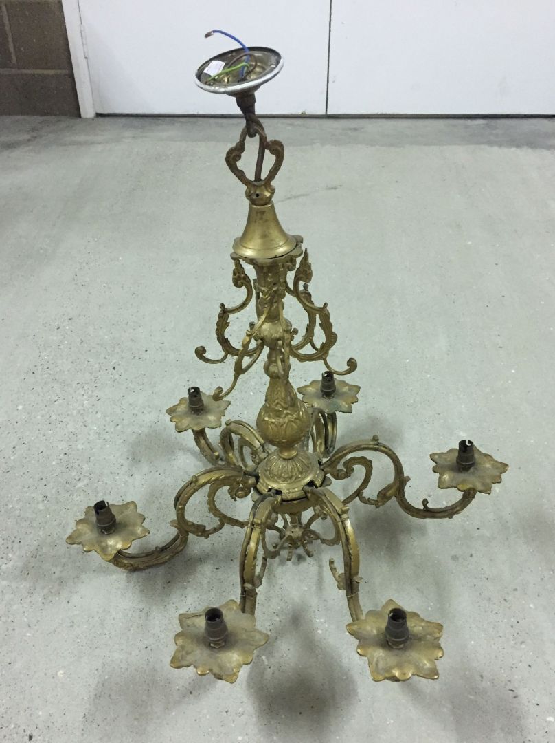 A vintage metal 6 branch chandelier painted gold and wired for electricity.