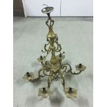 A vintage metal 6 branch chandelier painted gold and wired for electricity.