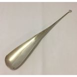 Silver shoehorn with hooked end to use as a button hook. Hallmarked Birmingham 1913. 270mm long,