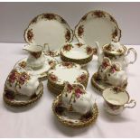 A Royal Albert "Old Country Roses" tea set comprising - 2 cake plates, 12 sandwich plates, teapot,