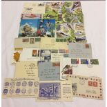 A quantity of mixed of first day covers and postcards.