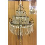 A Victorian 4 tier crystal and brass chandelier, complete with all drops in good order. With 3 point