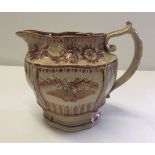 A Staffordshire pink lustre jug c1820-30 16cm tall.