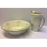 An Art Nouveau Minton bathroom jug and bowl, pink & green colour.