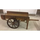 A wooden cart probably hand made for a shop display.